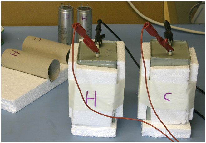 picture Paper in Oil and electrolytic capacitors being tested for soakage